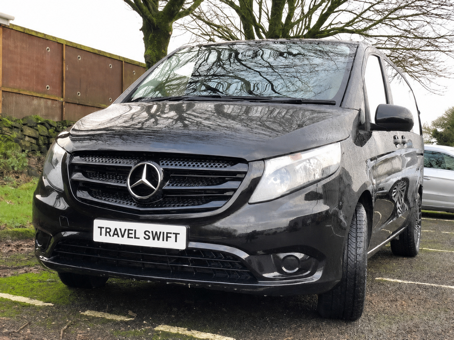 Black executive passenger vehicle representing the 6 seater executive category